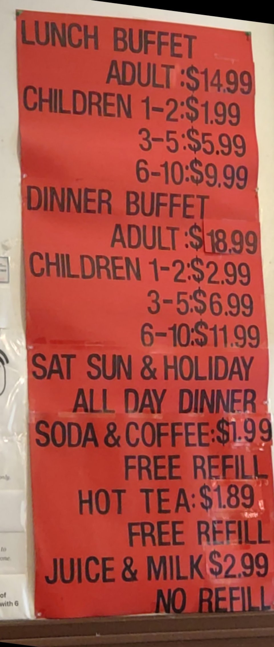 Restaurant food spread with sushi and hot entrees.